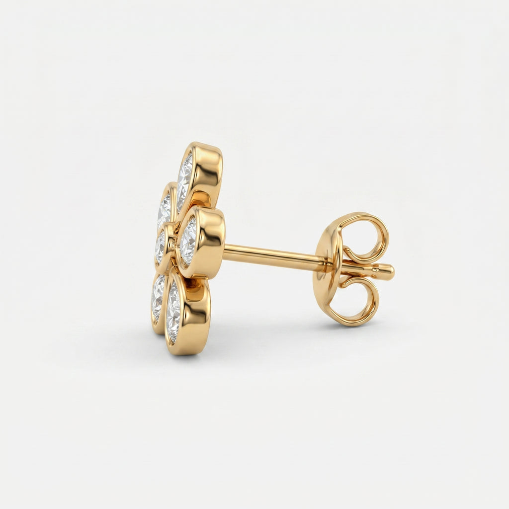 Yellow gold floral diamond stud earrings at 45-degree angle showing sparkle and premium craftsmanship