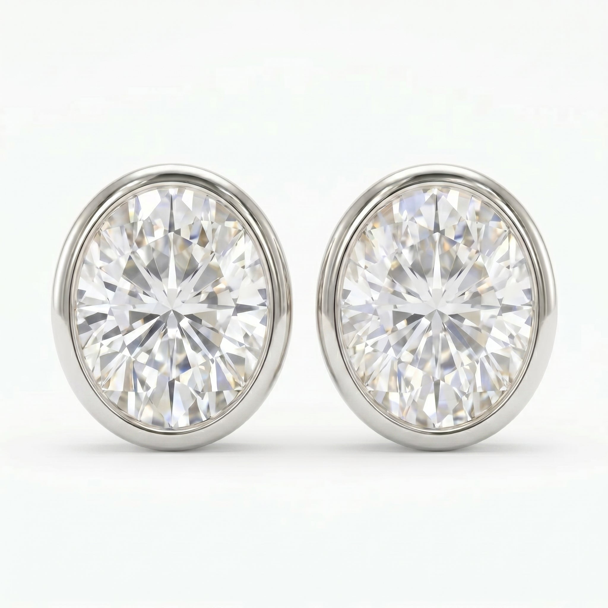 Pair of diamond stud earrings on a white background