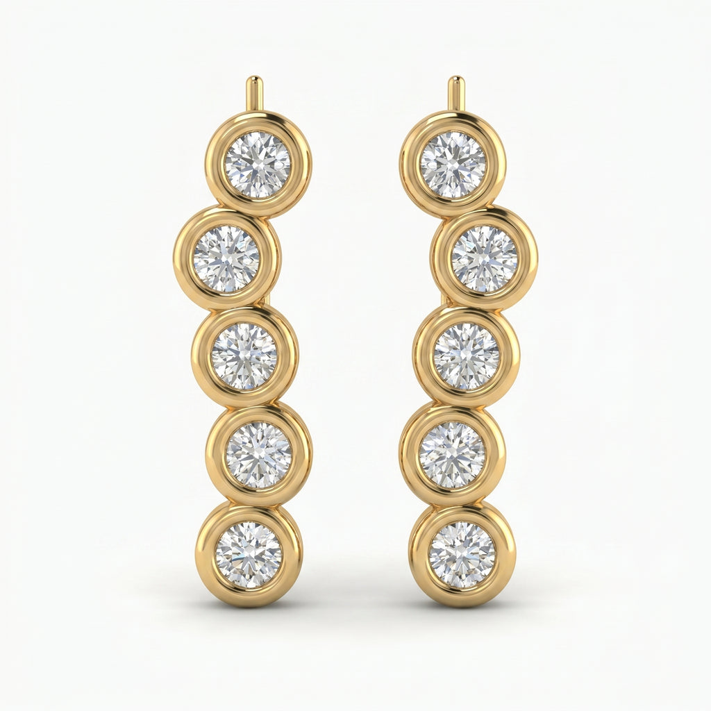 Luxury yellow gold ear crawler earrings with round bezel-set diamonds in angled studio product photo