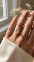 Elegant Round Cut Diamond Side Stone Ring with Pavé Band