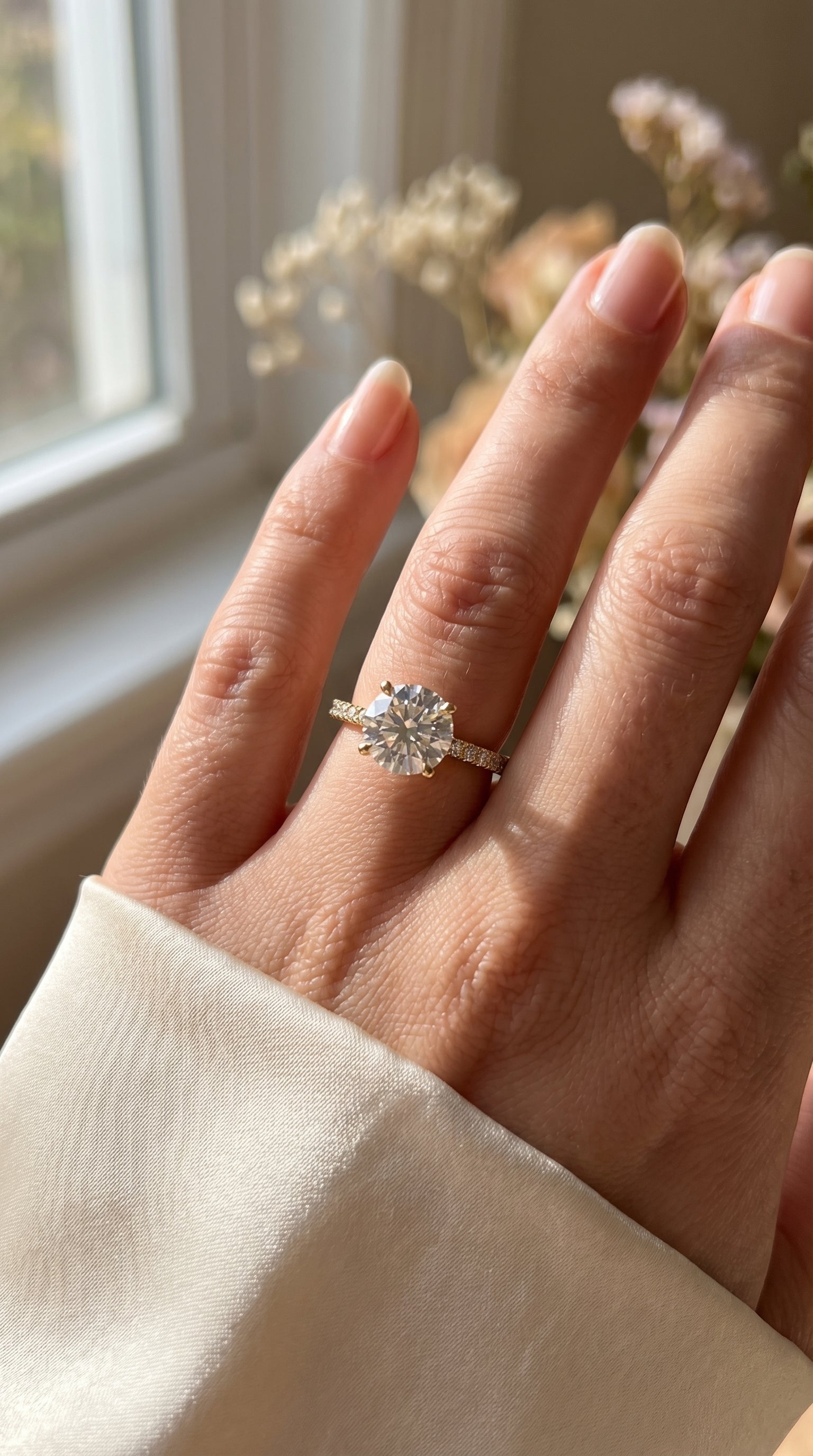 Elegant Round Cut Diamond Side Stone Ring with Pavé Band
