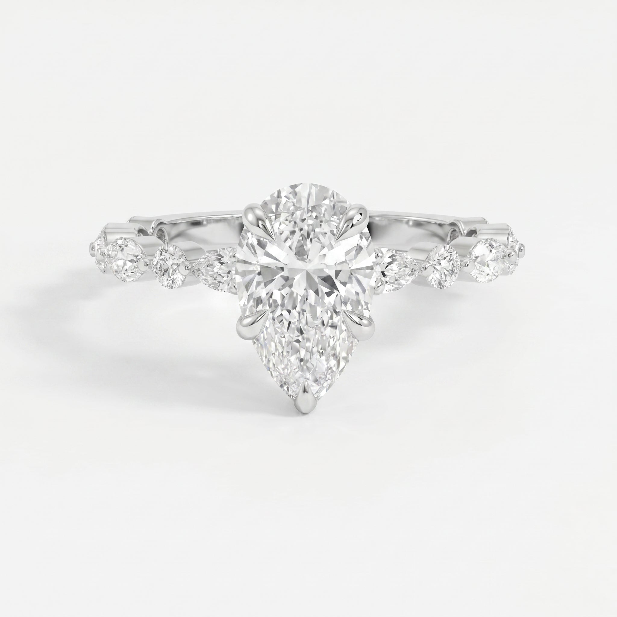 Elegant Pear Cut Diamond Side Stones Engagement Ring