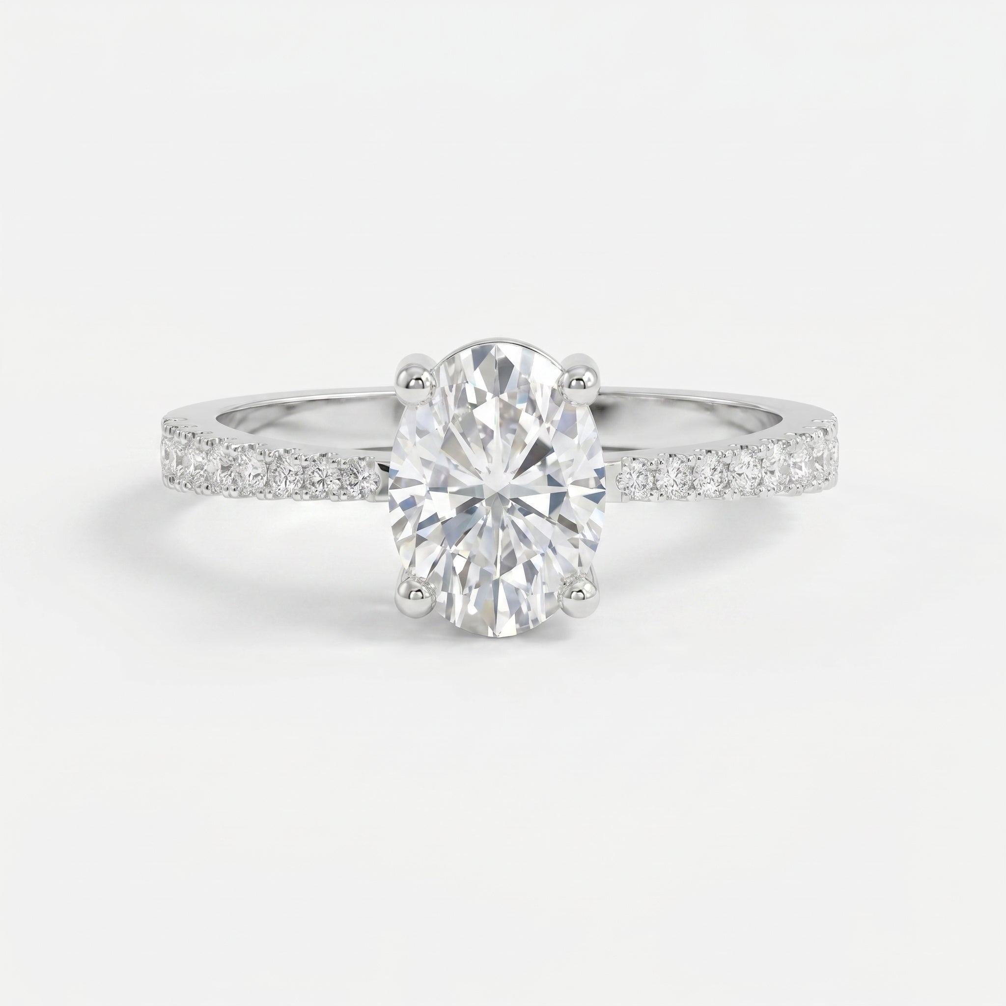 Oval Cut Diamond Side Stone Engagement Ring with Pavé Band