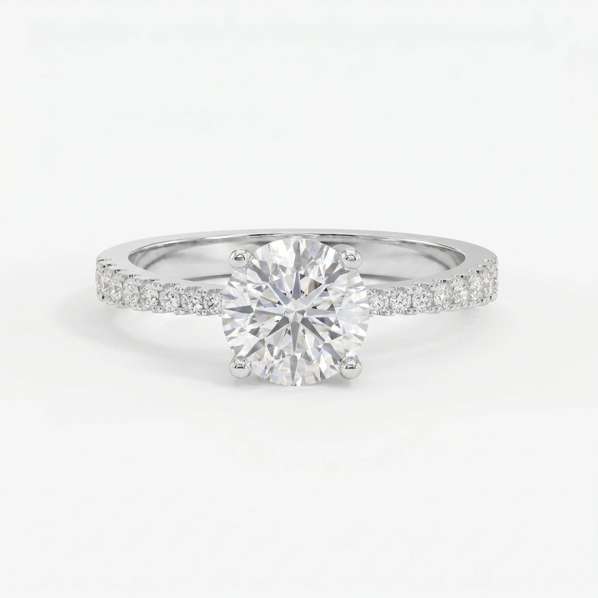 Elegant Round Cut Diamond Side Stone Ring with Pavé Band