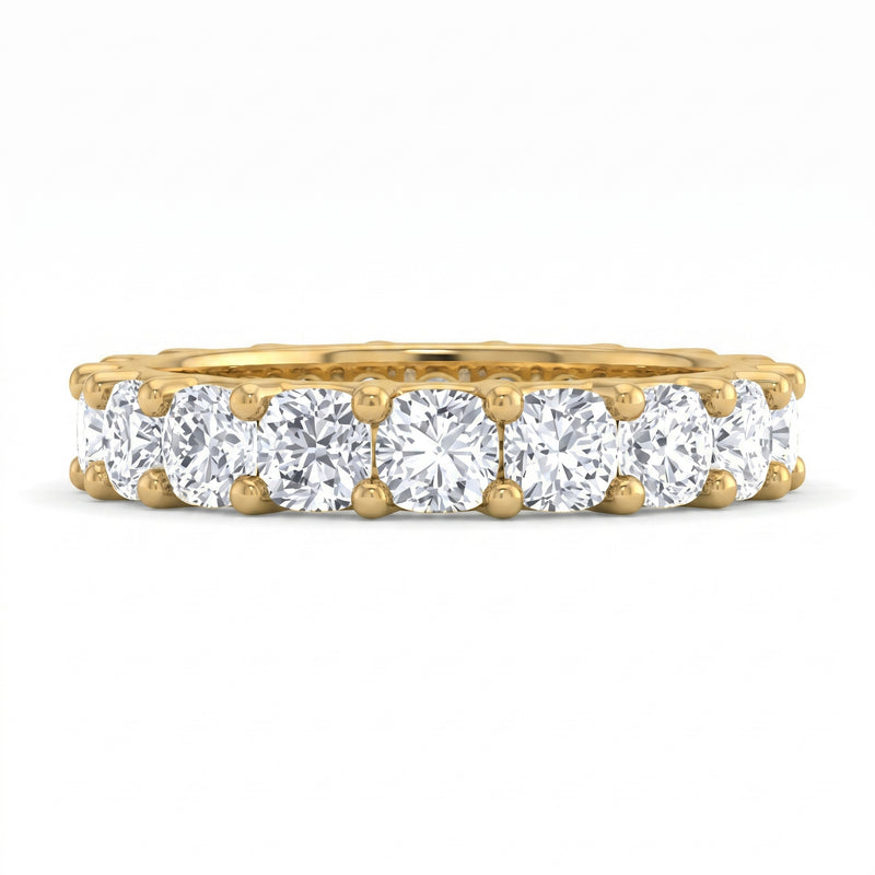 Gold ring with multiple diamonds on a white background