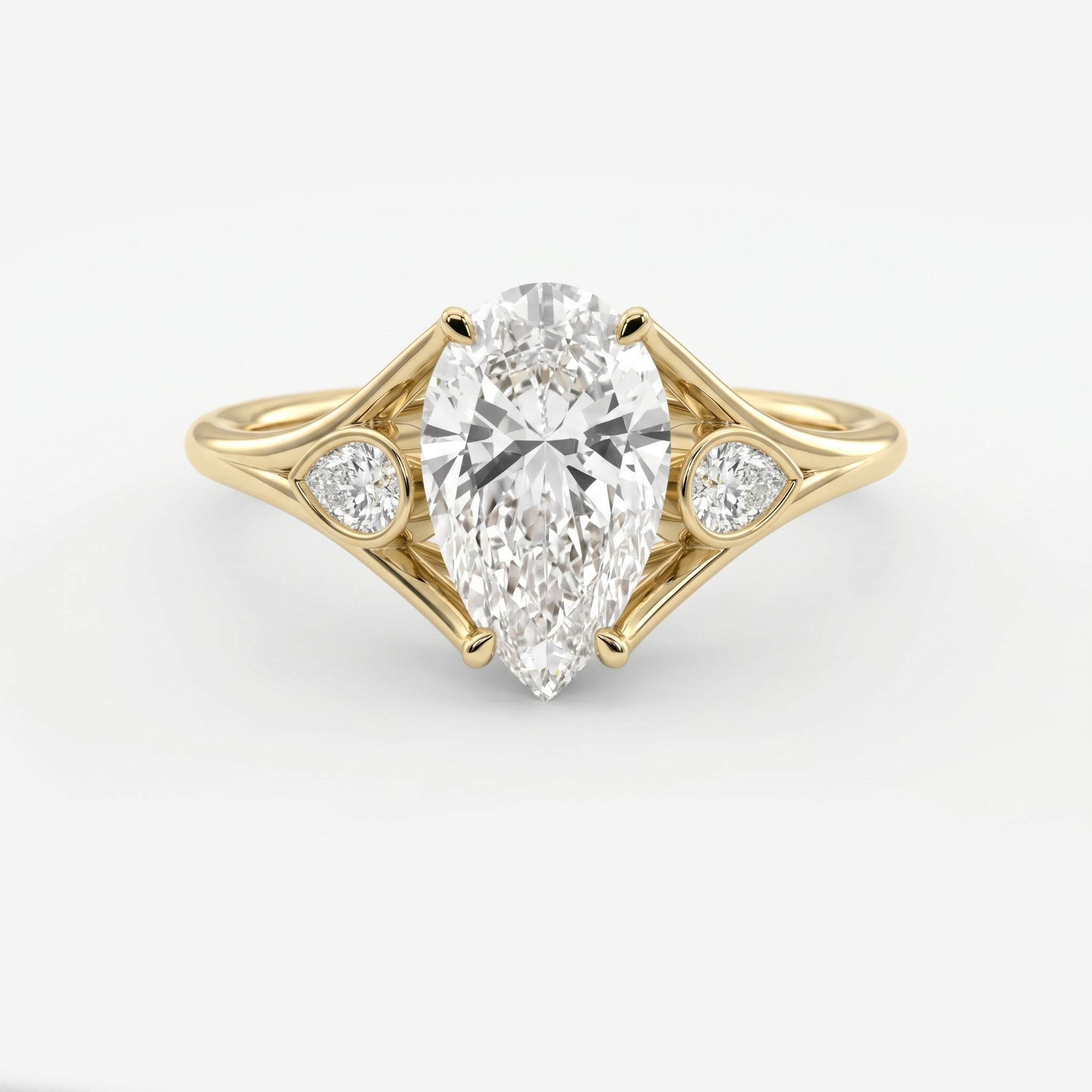 Custom 4‑Prong Diamond Ring with Bezel‑Set Pear Side Stones
