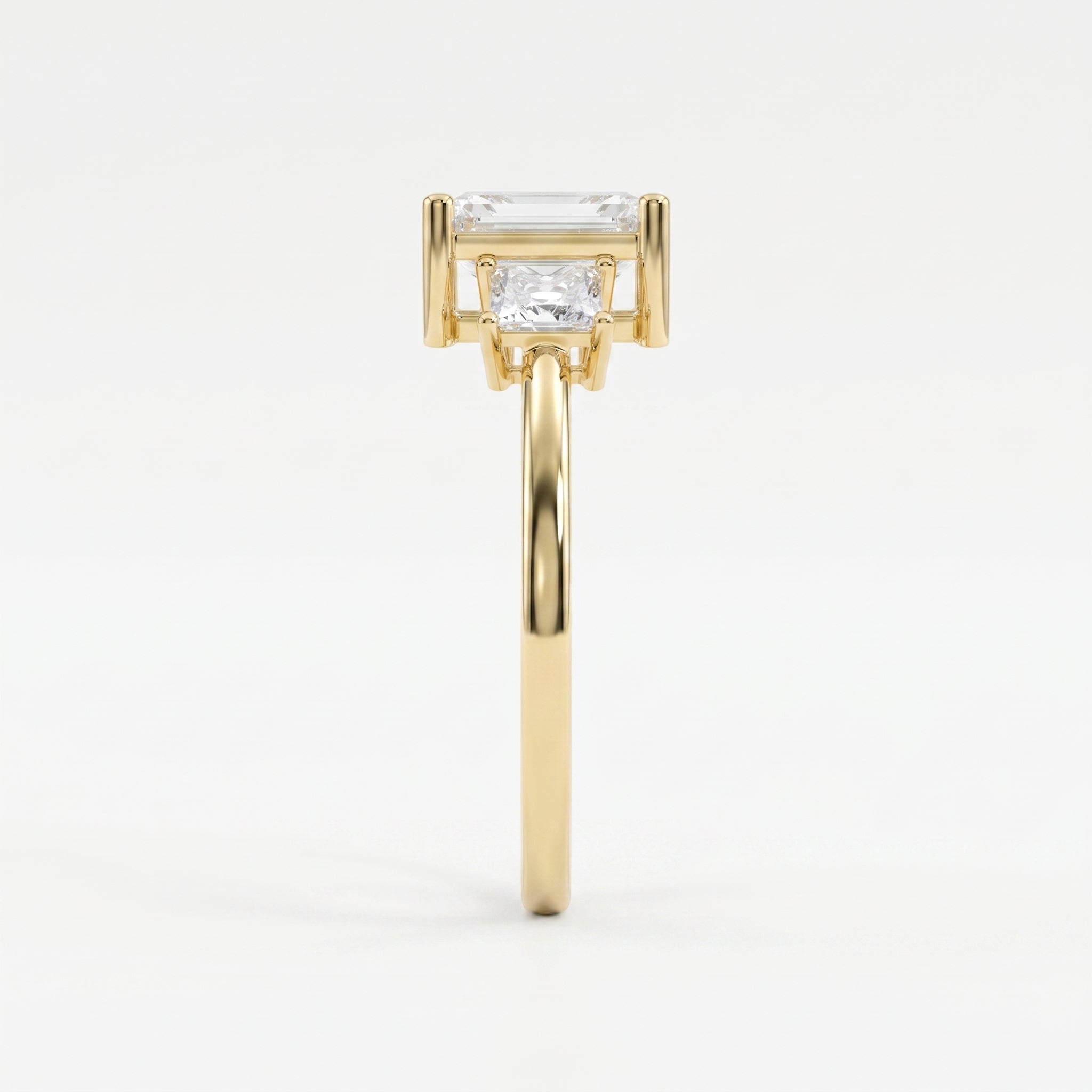 The Axis Trio Emerald Ring