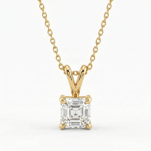 Gold necklace with a diamond pendant on a white background