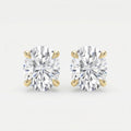 Pair of diamond stud earrings on a light gray background