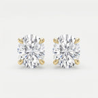 Pair of diamond stud earrings on a light gray background