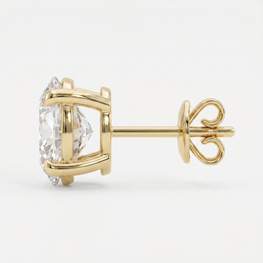 Gold earring with a clear gemstone on a white background