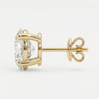 Gold earring with a clear gemstone on a white background
