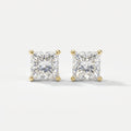 Pair of diamond stud earrings on a light gray background