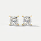 Pair of diamond stud earrings on a light gray background