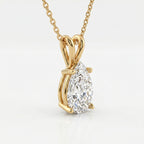 Gold necklace with a pear-shaped diamond pendant on a white background