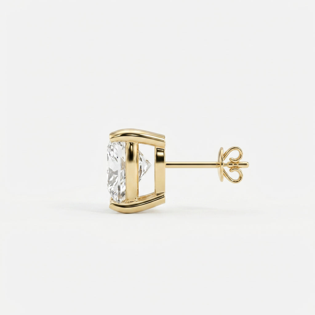Gold earring with a clear gemstone on a white background