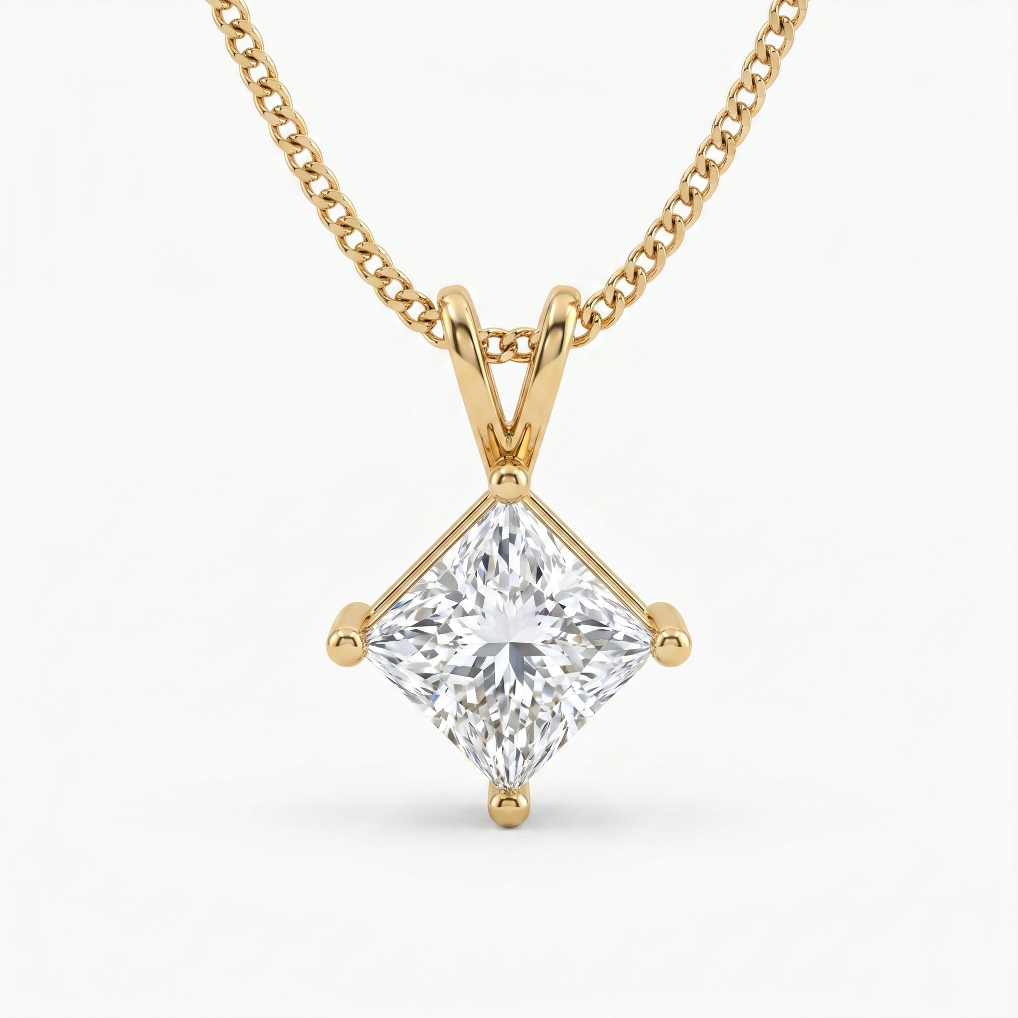 Gold necklace with a diamond pendant on a white background
