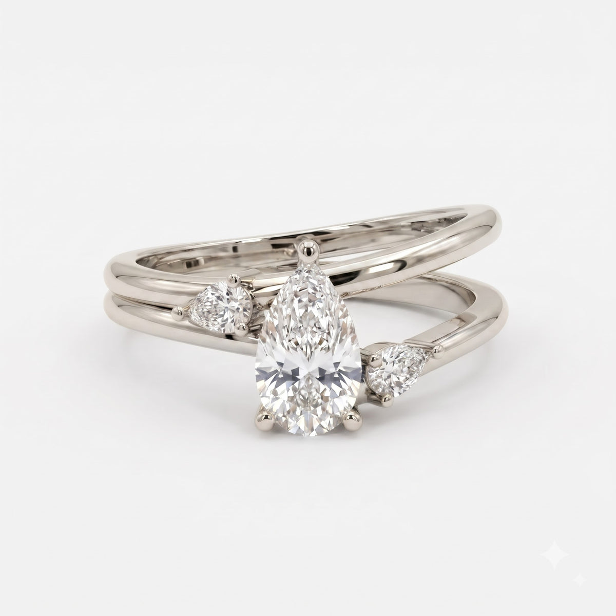 Celestial Embrace Pear Diamond three Stone Ring