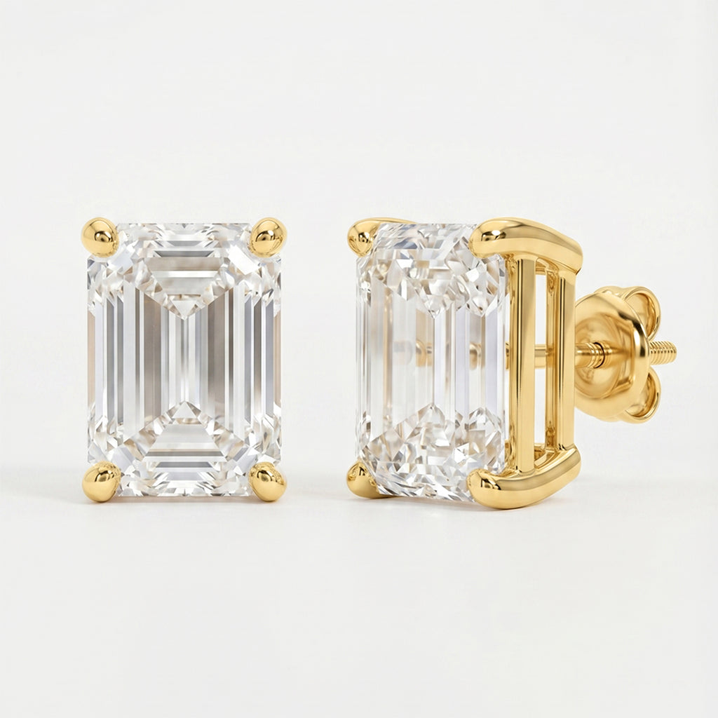 Gold emerald-cut diamond earrings on a light gray background