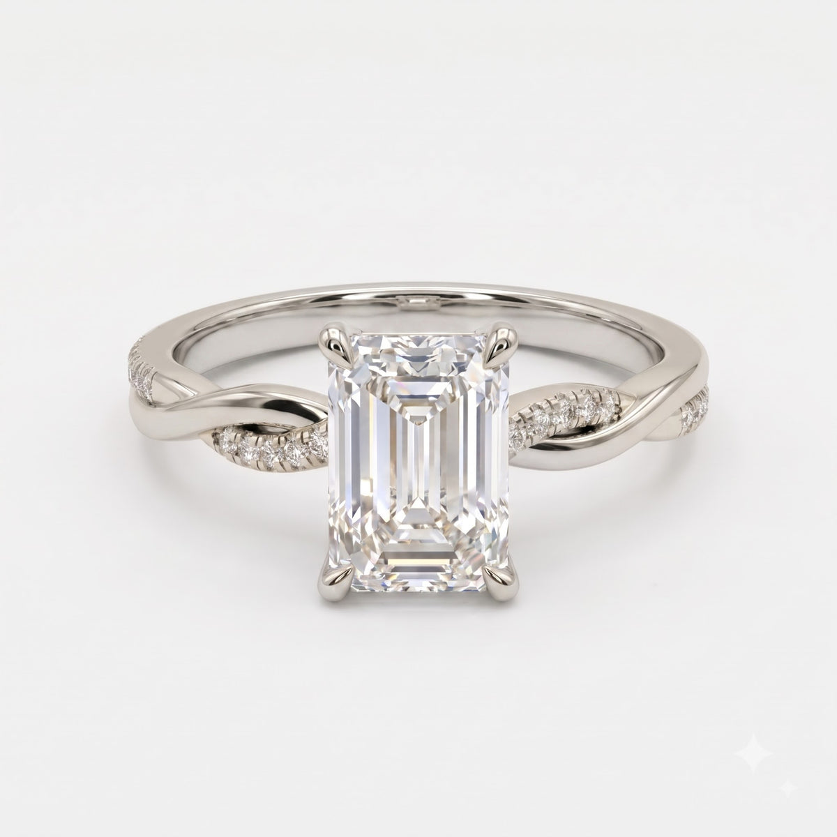 The Lumière Emerald Cut Diamond Twisted Pavé Side Stone Ring