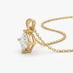 Gold necklace with a diamond pendant on a white background