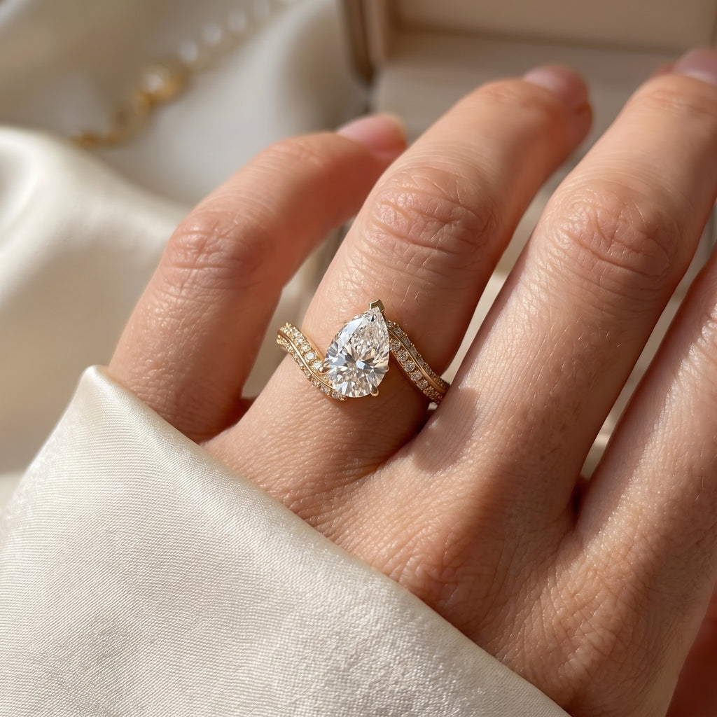 Elysian Twist Pear Diamond Side Stone Engagement Ring