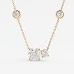 Round brilliant diamond station necklace in polished yellow gold featuring bezel-set accent diamonds on a fine chain.