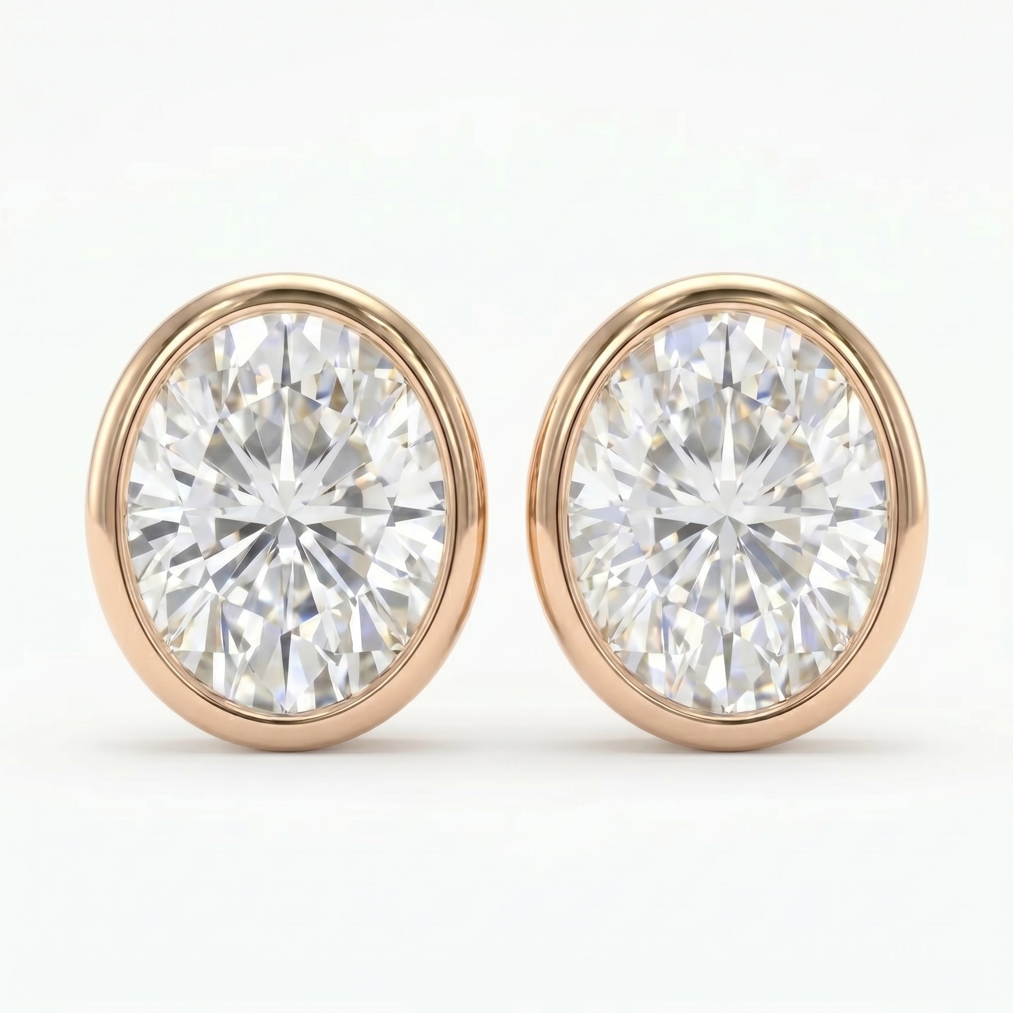 Pair of diamond stud earrings with rose gold settings on a white background