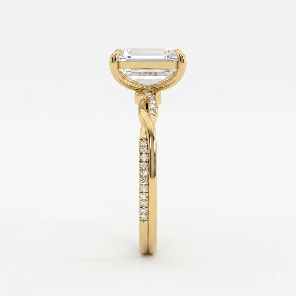 The Lumière Emerald Cut Diamond Twisted Pavé Side Stone Ring