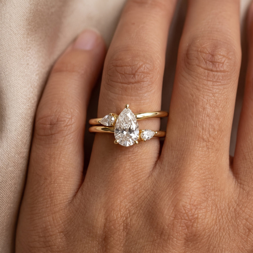 Celestial Embrace Pear Diamond three Stone Ring