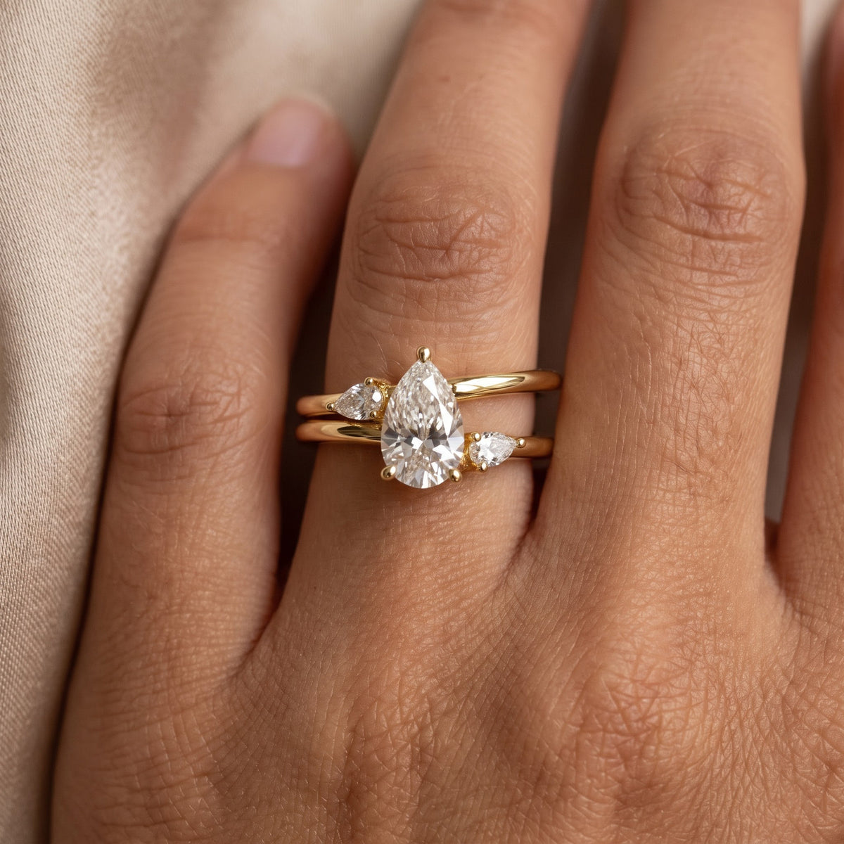 Celestial Embrace Pear Diamond three Stone Ring
