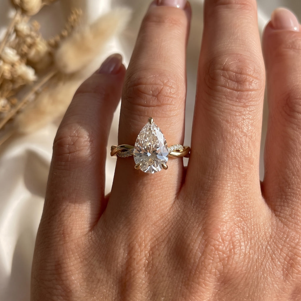 Seraphina Pear Diamond Crossover Side Stone Engagement Ring