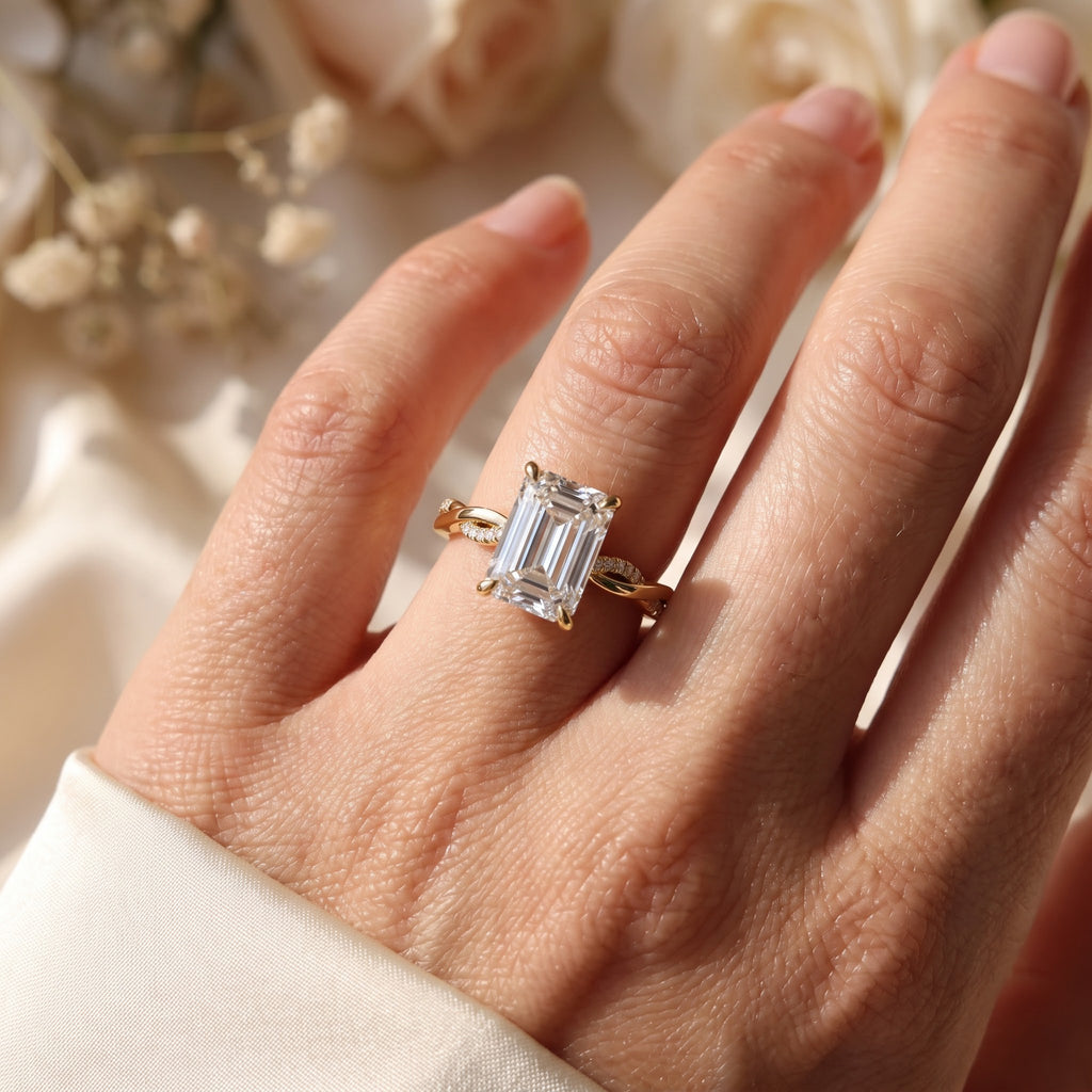 The Lumière Emerald Cut Diamond Twisted Pavé Side Stone Ring