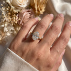 Celestia Oval Diamond Crossover Side Stone Engagement Ring