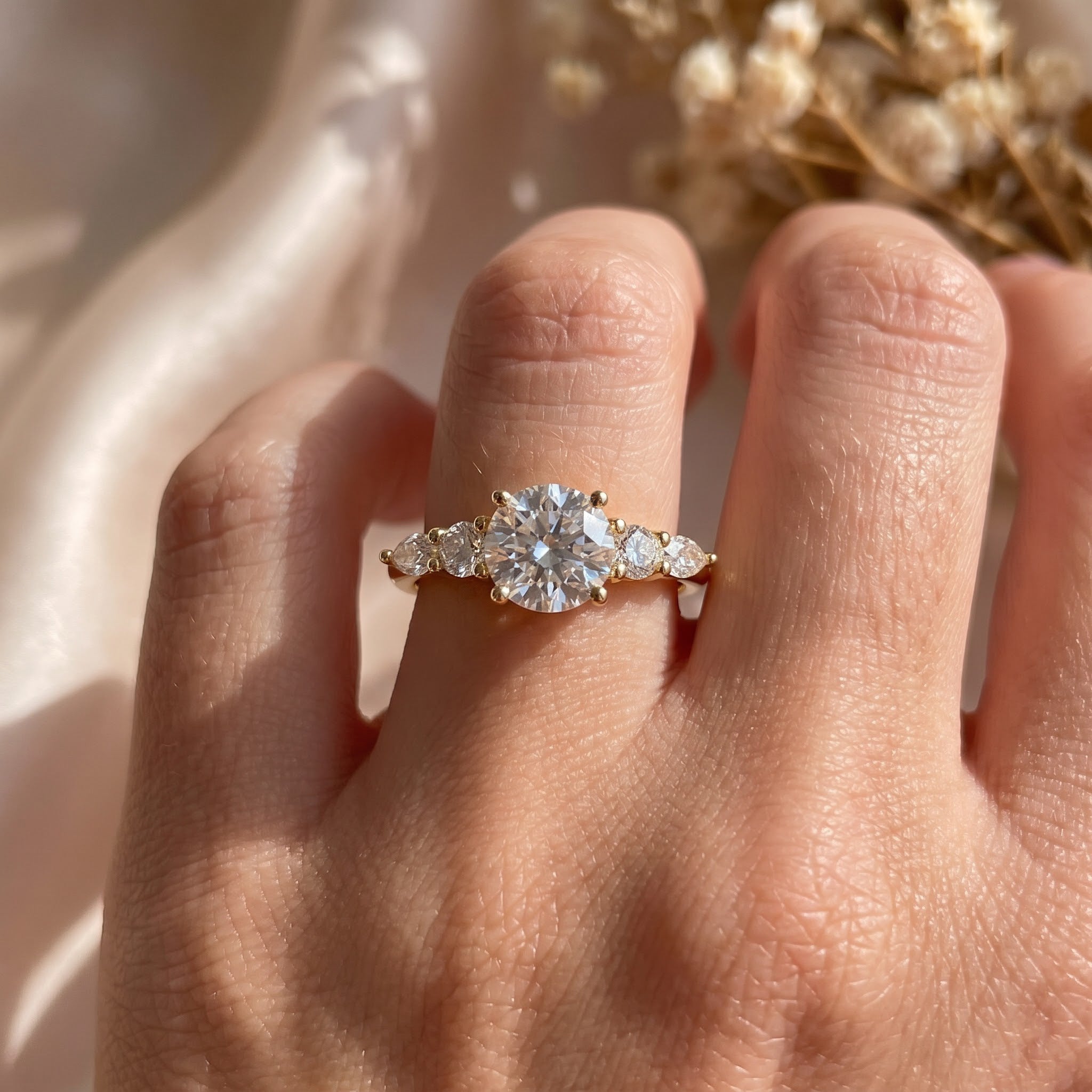Celestial Elegance Round Diamond Side Stone Engagement Ring