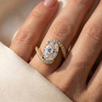 Celestia Twist Oval Diamond Crossover Side Stone Ring