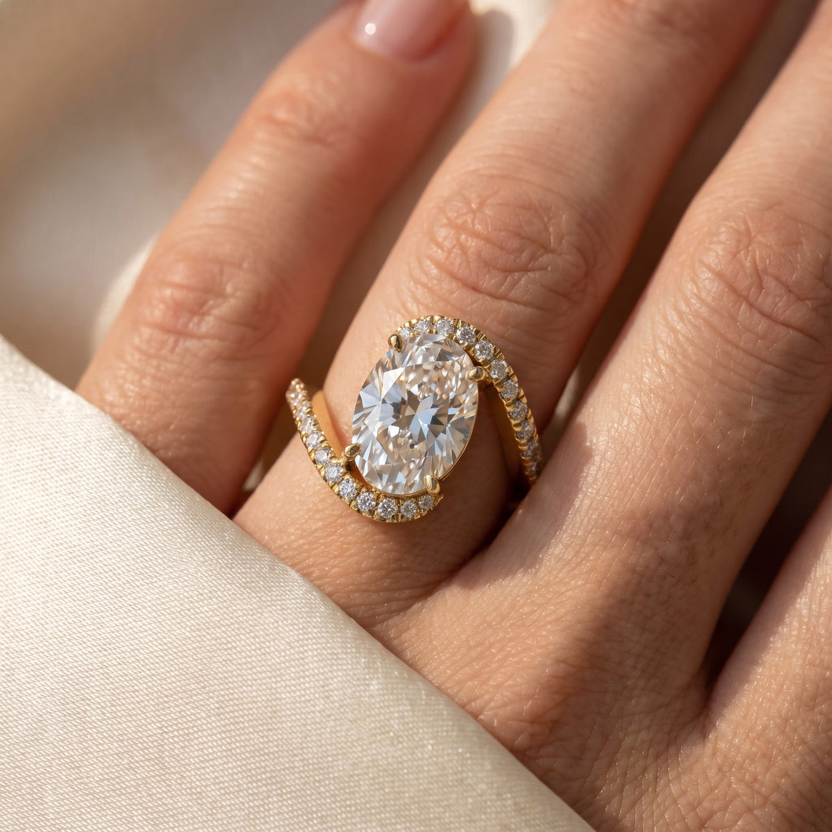 Celestia Twist Oval Diamond Crossover Side Stone Ring