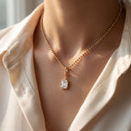 Elegant Emerald-Cut Solitaire Pendant with Beaded Gold Chain