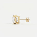 Gold earring with a clear gemstone on a white background