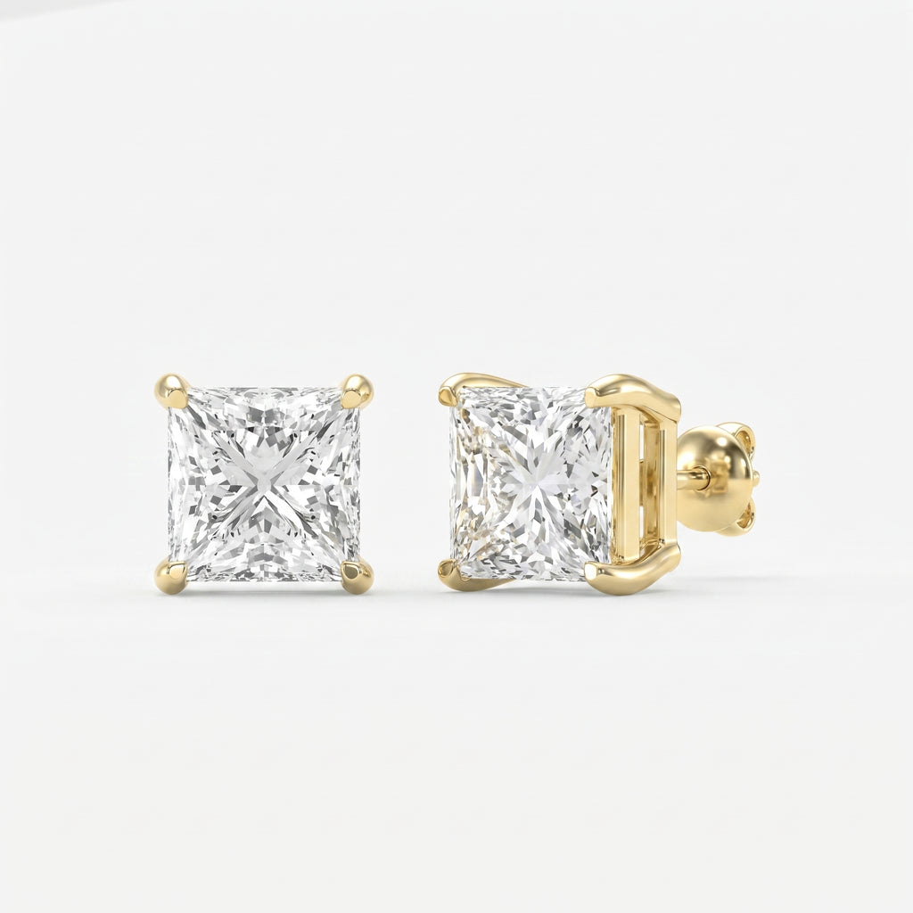 Gold earrings with square-cut diamonds on a white background