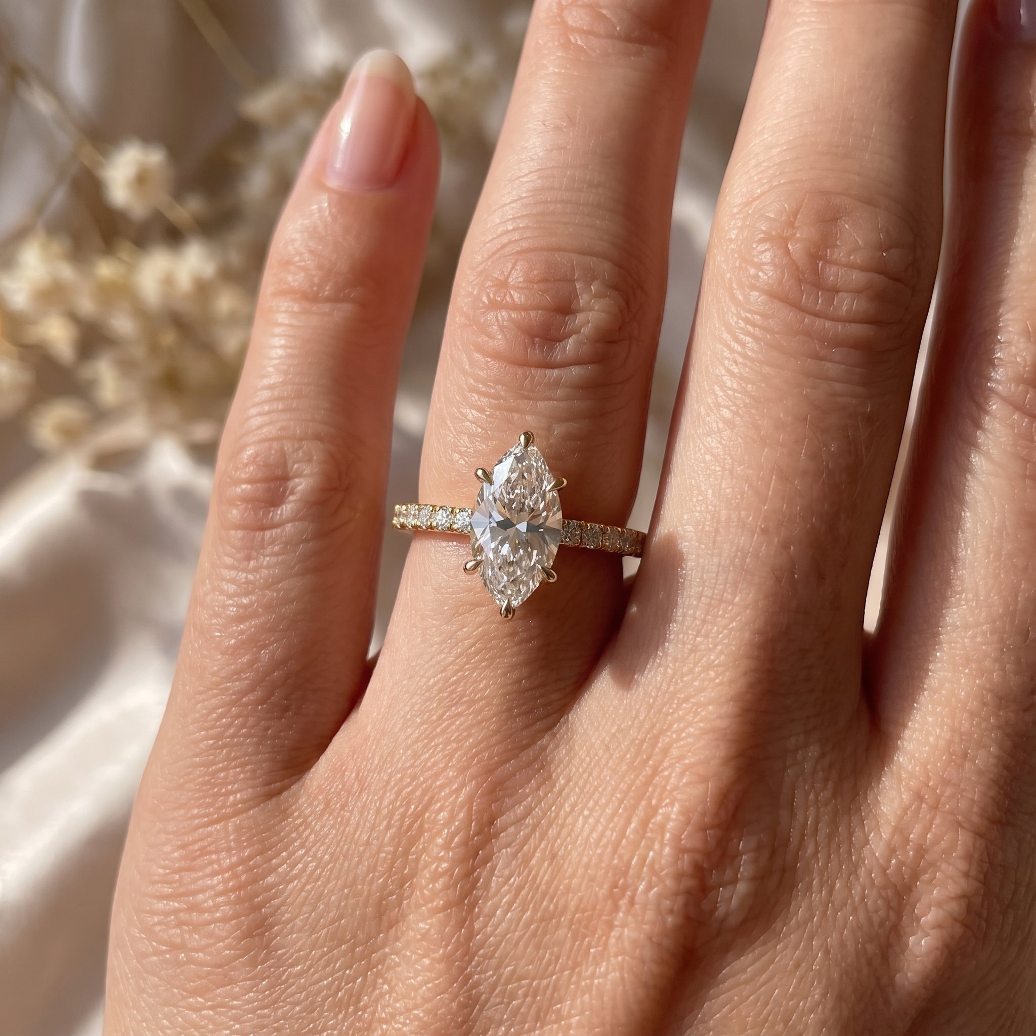Elegant marquise-cut diamond Side Stone engagement ring