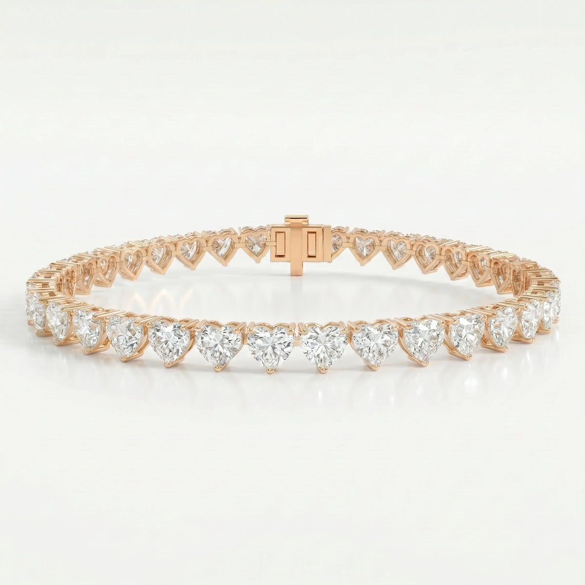 Rose gold heart-shaped diamond tennis bracelet with continuous gemstone design and luxury box clasp closure.