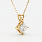 Gold necklace with a diamond pendant on a white background