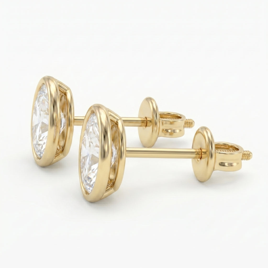 Gold earrings with clear gemstones on a white background