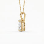 Gold pendant with a diamond on a white background