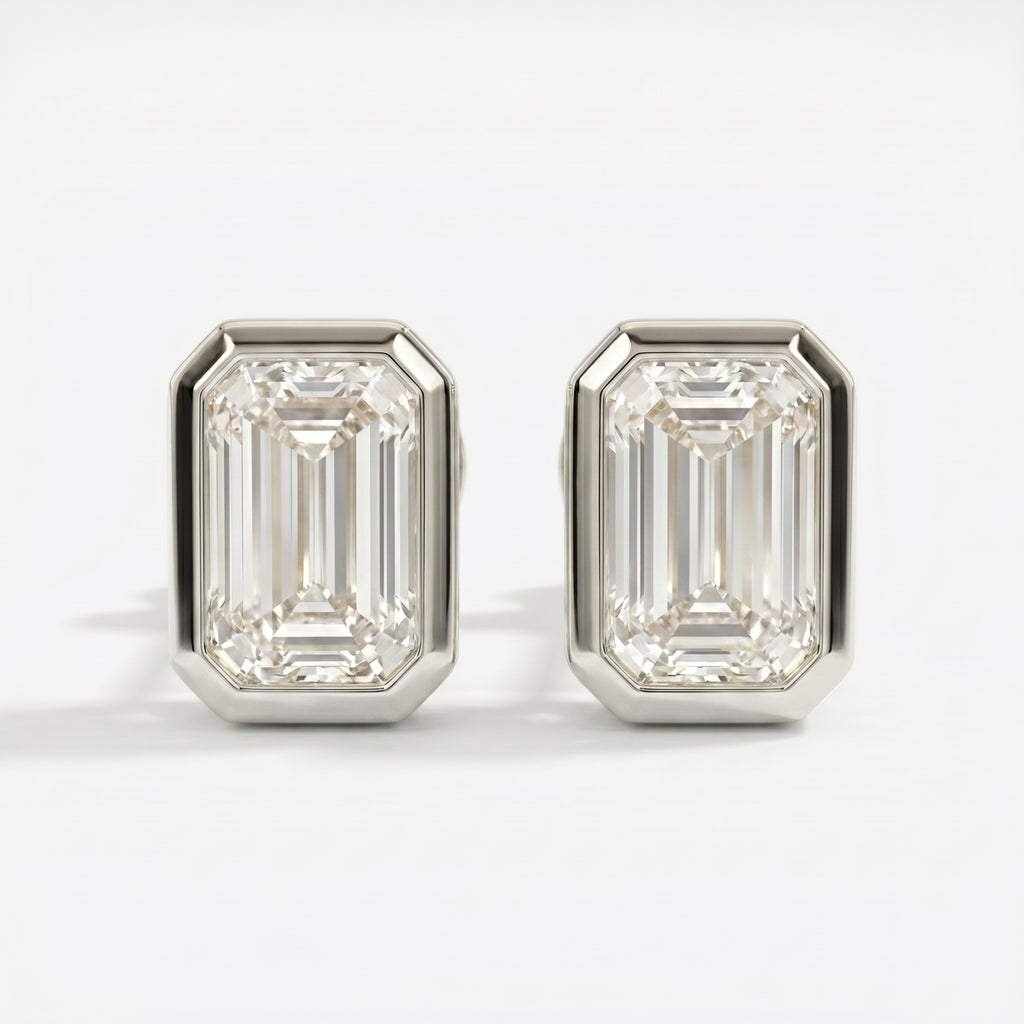 Pair of diamond stud earrings on a white background