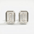 Pair of diamond stud earrings on a white background