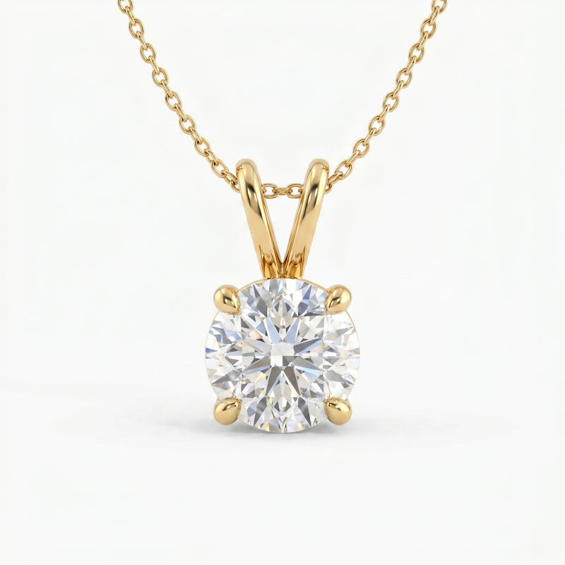 Gold necklace with a round diamond pendant on a white background