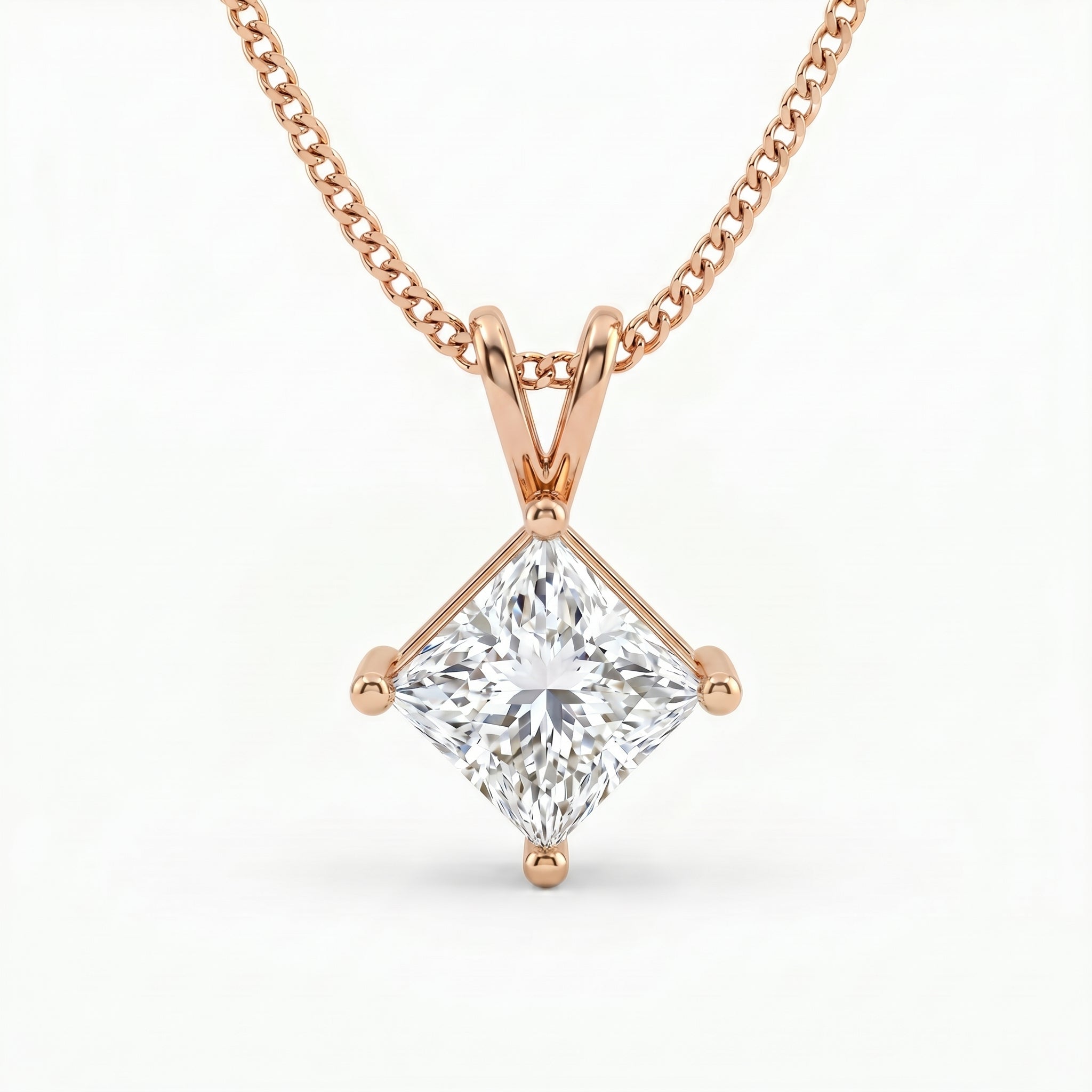Rose gold necklace with a diamond pendant on a white background