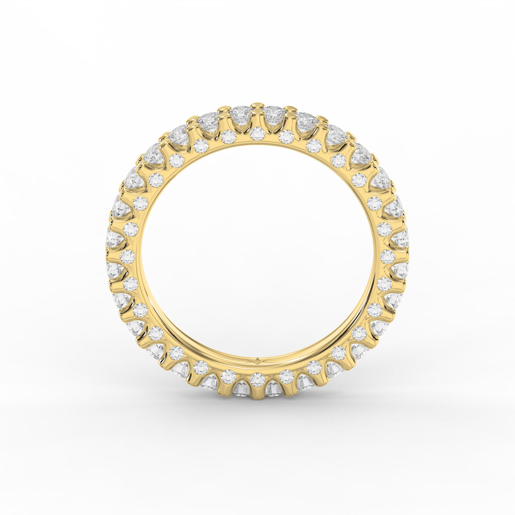 Yellow gold diamond eternity band featuring round brilliant diamonds in a shared prong setting for weddings and stacking.